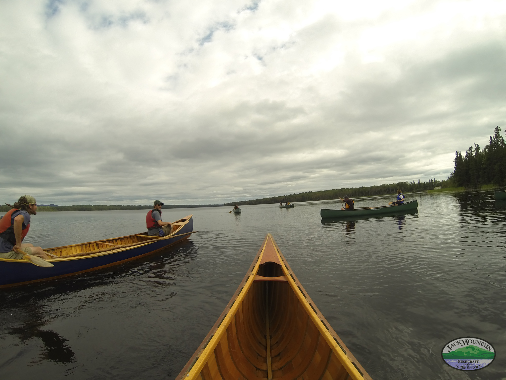 crossing headwater lakes in a canoe