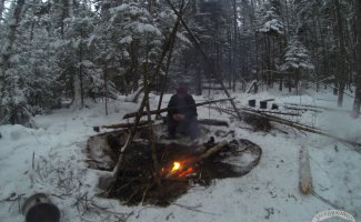 Cooking on a fire in winter.