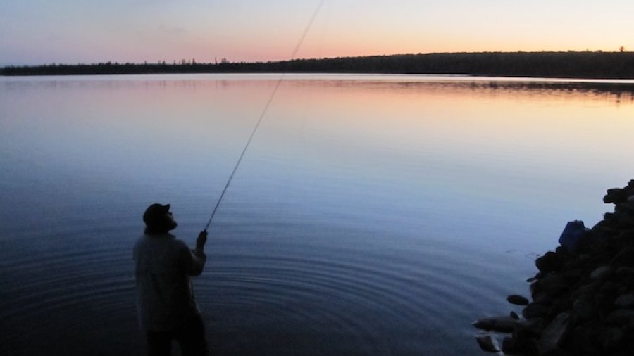 Casting a fly at dusk.