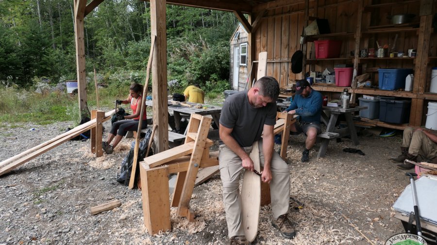 Students under the pavilion working on projects.