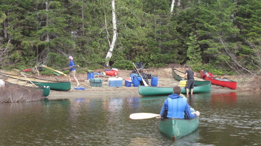 Unloading gear at a remote camp site