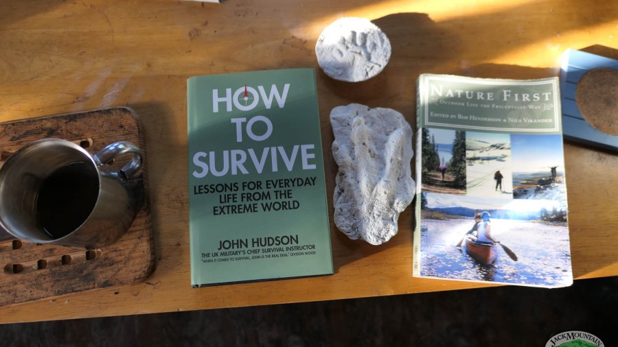 book How To Survive by John Hudson sitting on the table in the Guide Shack