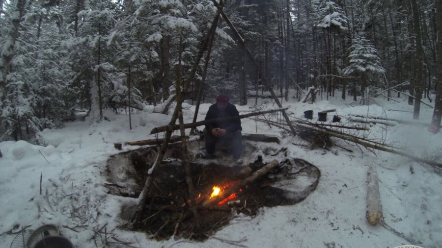 Cooking on a fire in winter.