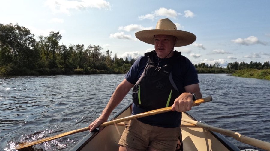 Tim canoeing in a remote area