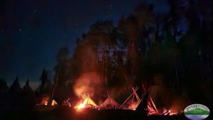 image of night fires in front of shelters for no sleeping bag exercise