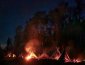 image of night fires in front of shelters for no sleeping bag exercise