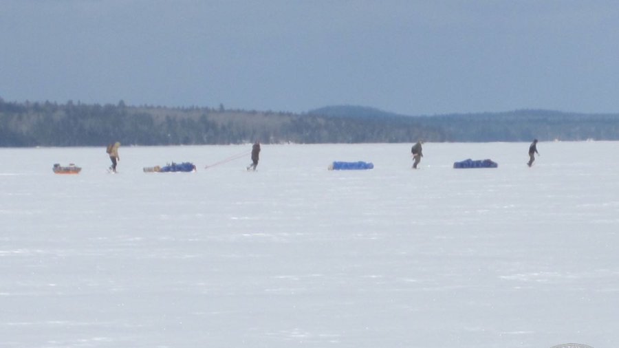hauling sleds across a frozen lake