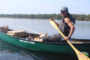 Sam paddling a canoe