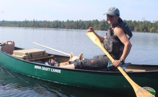 Sam paddling a canoe