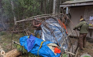 Survival shelter being built on a medical course