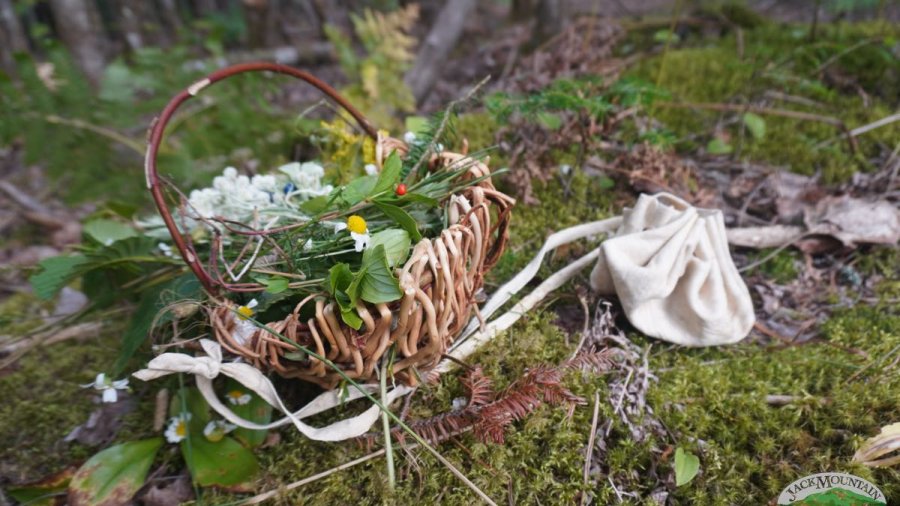 Handmade basket and braintan buckskin pouch.