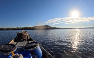 Sun rising over remote lake in northern Maine, as seen from canoe