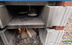 Sourdough bread baking in an outdoor oven