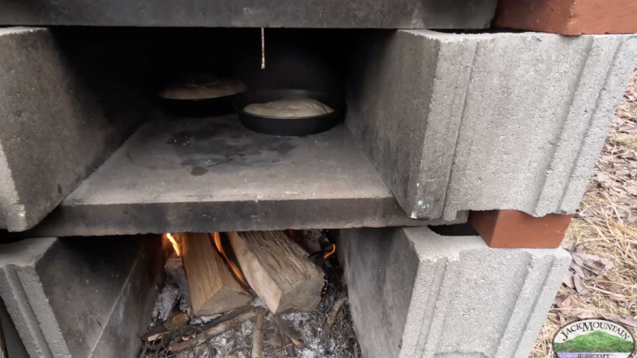 Sourdough bread baking in an outdoor oven