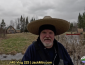 Tim walking near Grand Lac Samsquanch with canoes in the background