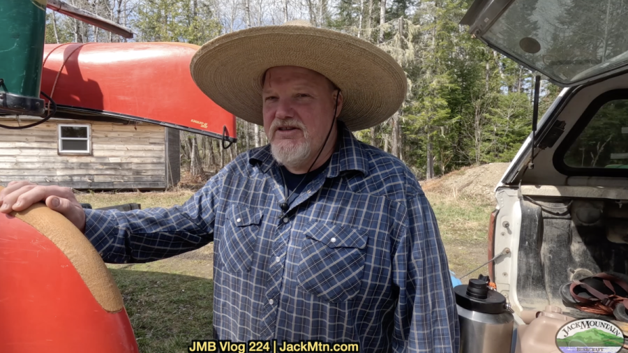 Tim standing by the canoe trailer