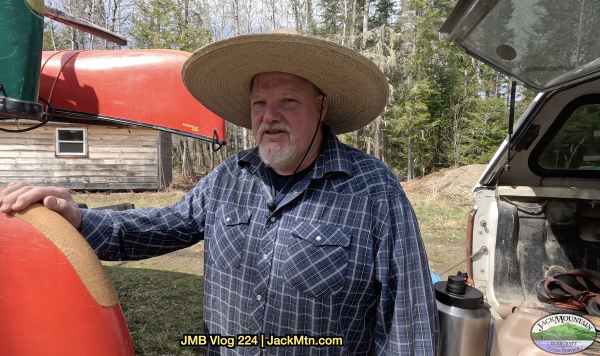 Tim standing by the canoe trailer