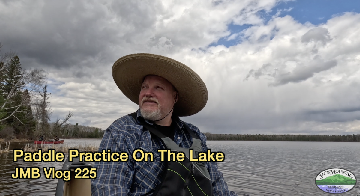 Tim in a canoe on a local lake. Paddle practice in canoes.