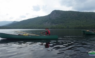 paddling past the mountain of Baxter state park, Maine