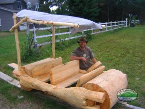 a wooden car, seen on a rural Quebec roadside