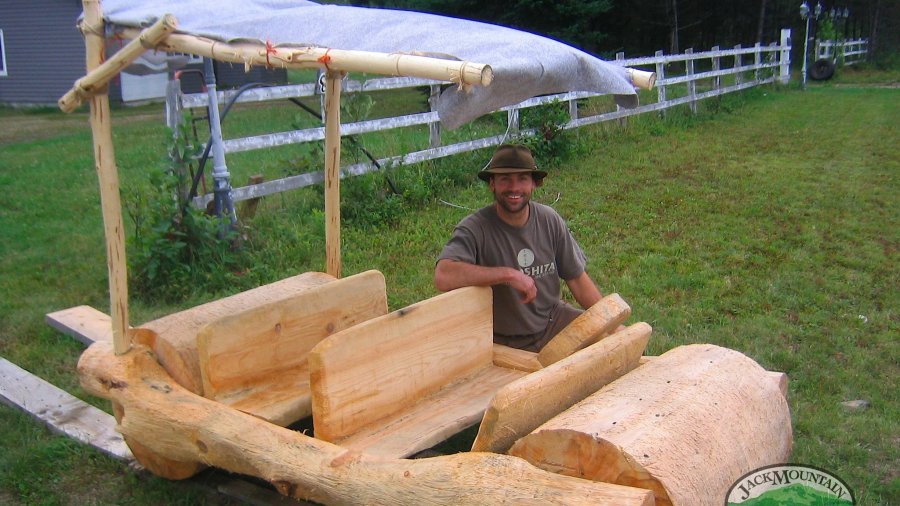 a wooden car, seen on a rural Quebec roadside