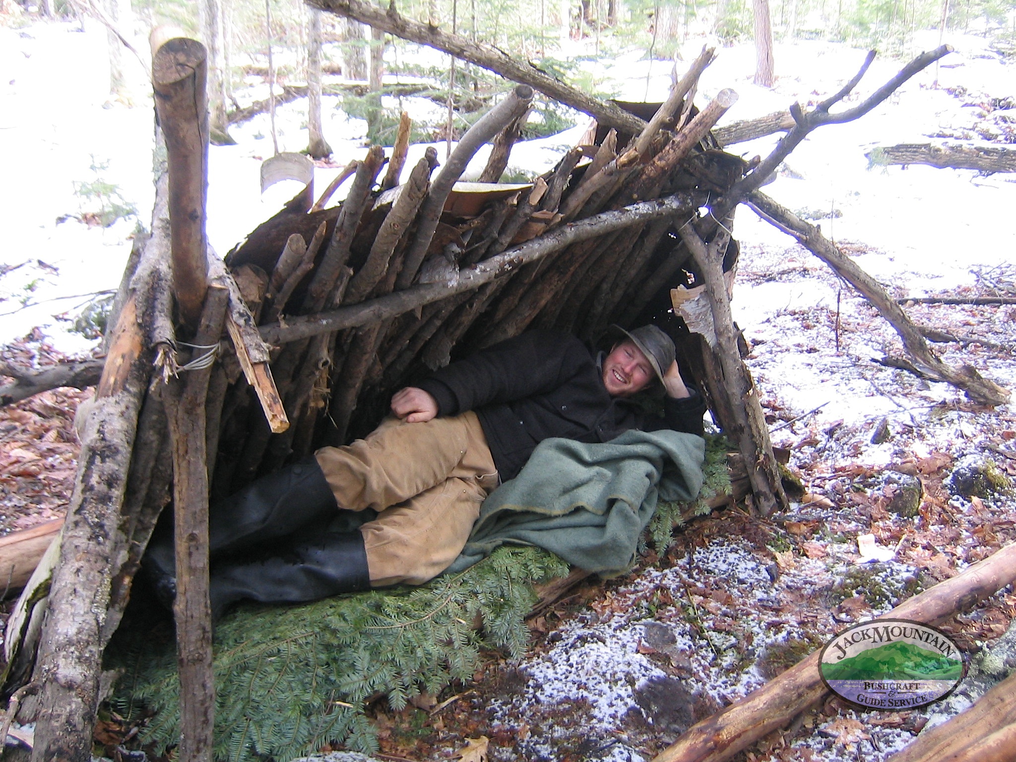 small lean-to made with birch bark